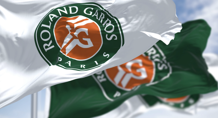 A white flag and a green flag both featuring the Roland Garros logo
