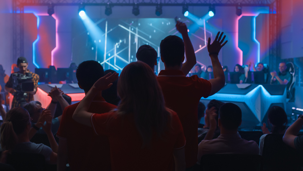 Esports team of professional gamers cheered by a crowd