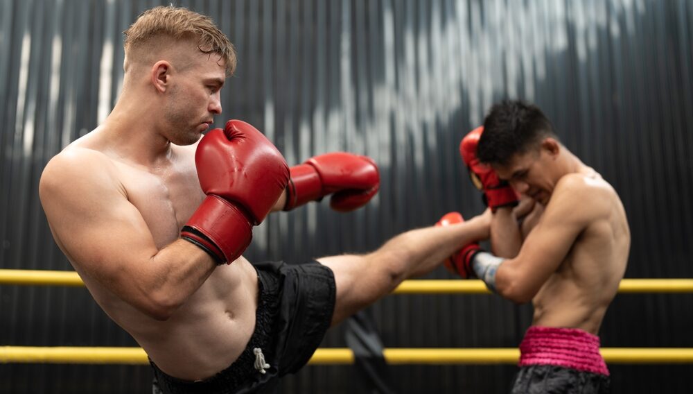 Two men kickboxing