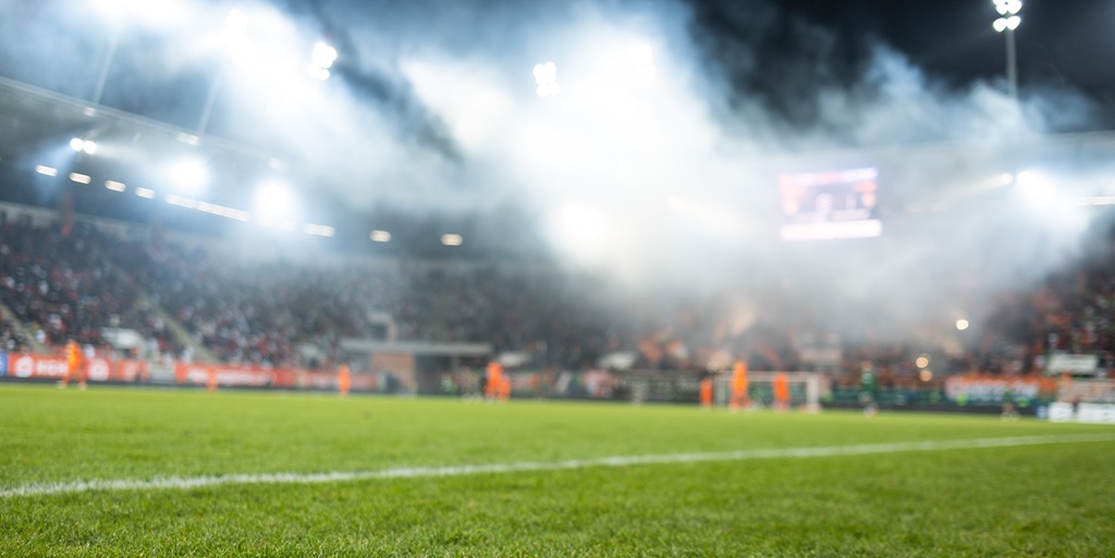 A sideline view of an international football match