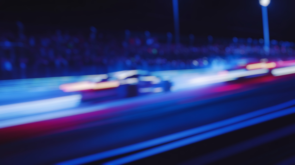 Blurred background of endurance cars racing on a track