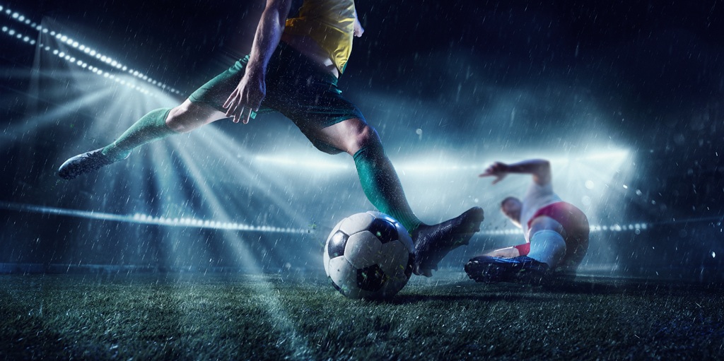 International tournament. Two competitive football players in motion