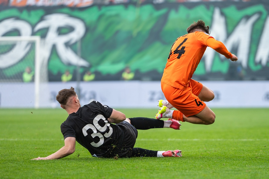 Brutal slide tackle and foul during football match