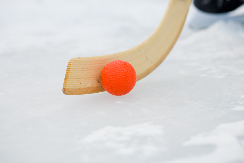 Bandy,Stick,And,Bandy,Ball,On,Ice,,Skates,In,The