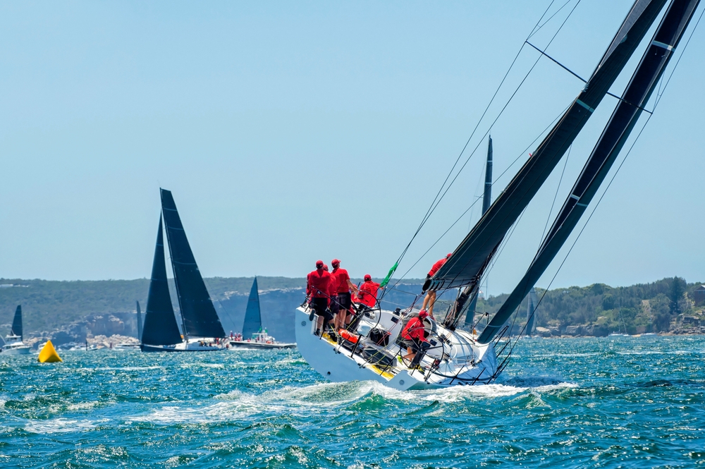 Sailing team turns in race Sailing team turns in race