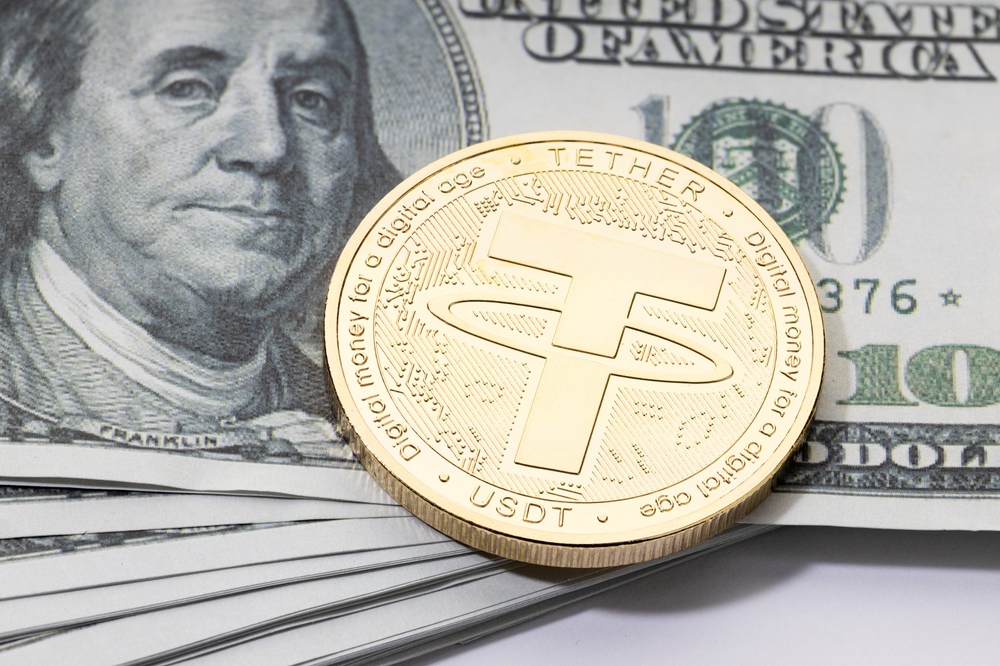 Tether coin on 100 dollar bills.