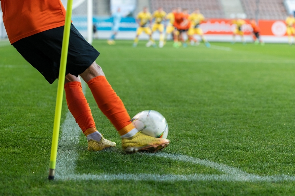 A football player takes a corner