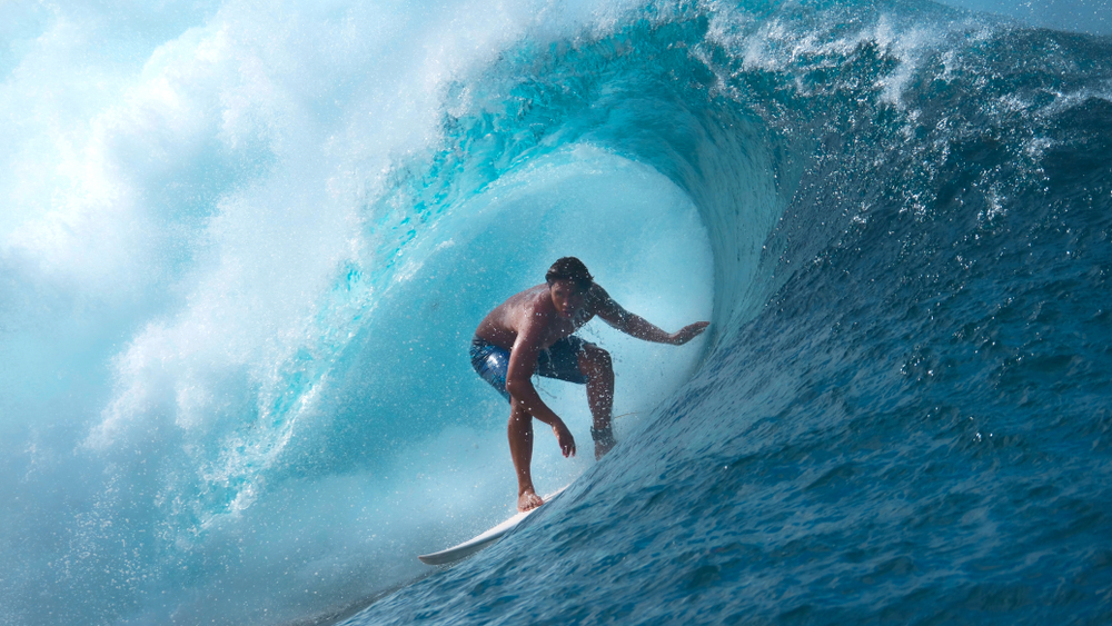 Surfer in tube of wave