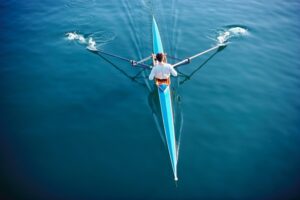single scull rower on water
